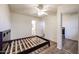 Bedroom with ceiling fan, mirrored closet, and access to bathroom at 9233 E Neville Ave # 1136, Mesa, AZ 85209