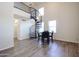 Bright dining area with spiral staircase and wood-look floors at 9233 E Neville Ave # 1136, Mesa, AZ 85209