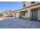 Two-story house exterior with a gray door and attached two-car garage at 3795 E Latham Ct, Gilbert, AZ 85297