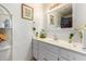 Clean bathroom with white vanity and a mirrored medicine cabinet at 417 N 38Th Ave, Phoenix, AZ 85009