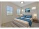 Guest bedroom with window shutters and ceiling fan at 16375 S 180Th Dr, Goodyear, AZ 85338