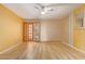 Spacious living room with laminate wood flooring and an accent wall at 310 N 65Th St # 13, Mesa, AZ 85205