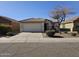 One-story home with a tile roof and two-car garage at 5020 S 25Th Ave, Phoenix, AZ 85041