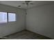 Small bedroom with neutral walls and carpeted floors at 5020 S 25Th Ave, Phoenix, AZ 85041