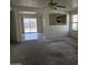 Open living room with views to the backyard and kitchen at 5020 S 25Th Ave, Phoenix, AZ 85041