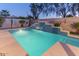 Inviting pool with waterfall feature at 15749 W Roanoke Ave, Goodyear, AZ 85395