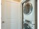 Stackable washer and dryer in a closet at 36145 N Desert Tea Dr, Queen Creek, AZ 85140