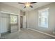 Bedroom with mirrored closet doors and window at 36145 N Desert Tea Dr, Queen Creek, AZ 85140