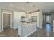 Modern kitchen with stainless steel appliances and an island at 36145 N Desert Tea Dr, Queen Creek, AZ 85140