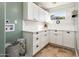 Clean laundry room featuring white cabinets and a window at 5365 E Shiprock St, Apache Junction, AZ 85119