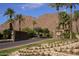 Gated community entrance with landscaping and water feature at 6321 E Phoenician Blvd # 14, Scottsdale, AZ 85251