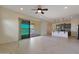 Open concept living room with kitchen and pond views at 16375 S 180Th Dr, Goodyear, AZ 85338