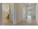 Hallway with tile floors and bathroom access at 16375 S 180Th Dr, Goodyear, AZ 85338