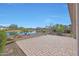 Backyard patio with lake view and desert landscaping at 16375 S 180Th Dr, Goodyear, AZ 85338