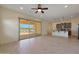 Living room, open floor plan with kitchen and pond views at 16375 S 180Th Dr, Goodyear, AZ 85338
