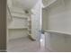 Large walk-in closet with custom shelving and hanging rods at 16375 S 180Th Dr, Goodyear, AZ 85338