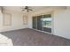Covered patio with sliding glass doors and ceiling fan at 16375 S 180Th Dr, Goodyear, AZ 85338