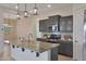 Spacious kitchen featuring granite countertops and stainless steel appliances at 16375 S 180Th Dr, Goodyear, AZ 85338