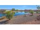 Waterfront property with lake view and landscaping at 16375 S 180Th Dr, Goodyear, AZ 85338