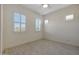Bright bedroom with tile flooring and plantation shutters at 16375 S 180Th Dr, Goodyear, AZ 85338
