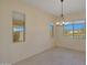 Bright dining room with large windows and a chandelier at 16375 S 180Th Dr, Goodyear, AZ 85338