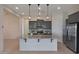 Modern kitchen with granite countertops and stainless steel appliances at 16375 S 180Th Dr, Goodyear, AZ 85338