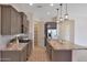 Modern kitchen with granite countertops and stainless steel appliances at 16375 S 180Th Dr, Goodyear, AZ 85338