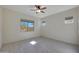 Bright bedroom with tile floors and ceiling fan at 16375 S 180Th Dr, Goodyear, AZ 85338