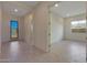 Home entryway with tile flooring and glass front door at 16375 S 180Th Dr, Goodyear, AZ 85338