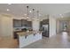 Modern kitchen with granite countertops, stainless steel appliances, and an island at 16375 S 180Th Dr, Goodyear, AZ 85338