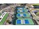 Aerial view of community pickleball courts with players enjoying a game at 16375 S 180Th Dr, Goodyear, AZ 85338