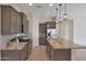 Open kitchen with granite countertops, stainless steel appliances, and an island at 16375 S 180Th Dr, Goodyear, AZ 85338