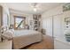 Bright bedroom with double bed and window seat at 25210 N 90Th Way, Scottsdale, AZ 85255