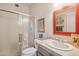 Clean bathroom with shower, sink, and framed artwork at 25210 N 90Th Way, Scottsdale, AZ 85255