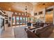 Large living room with vaulted wood ceilings, fireplace and access to backyard at 25210 N 90Th Way, Scottsdale, AZ 85255