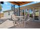 Covered patio with spiral staircase and seating area at 25210 N 90Th Way, Scottsdale, AZ 85255