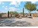 Landscaped backyard with fire pit and seating area at 25210 N 90Th Way, Scottsdale, AZ 85255