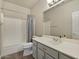 Clean bathroom with a shower/tub combo, toilet and vanity at 41115 N Eagle Trl, Anthem, AZ 85086