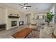 Living room with fireplace and hardwood floors at 41115 N Eagle Trl, Anthem, AZ 85086