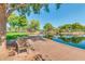 Landscaped pond with a walking path and park bench at 41115 N Eagle Trl, Anthem, AZ 85086