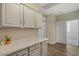 Laundry room with white cabinets and countertop at 41115 N Eagle Trl, Anthem, AZ 85086