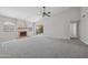 Spacious living room with fireplace and sliding glass doors at 2164 S Catarina --, Mesa, AZ 85202