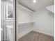 Large walk-in closet with double hanging rods at 2164 S Catarina --, Mesa, AZ 85202
