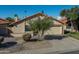 Tan two-car garage home with a terracotta tile roof at 2164 S Catarina --, Mesa, AZ 85202