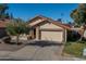 Tan two-car garage home with a terracotta tile roof at 2164 S Catarina --, Mesa, AZ 85202