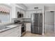 Updated kitchen with white cabinets and stainless steel appliances at 2164 S Catarina --, Mesa, AZ 85202