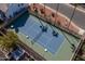 Tennis court with a green surface and palm trees at 2164 S Catarina --, Mesa, AZ 85202