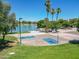 Two basketball courts near a lake, palm trees, and grassy areas at 2164 S Catarina --, Mesa, AZ 85202