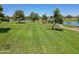 Green grassy park area with a gazebo by the lake at 2164 S Catarina --, Mesa, AZ 85202