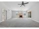 Spacious living room with fireplace and sliding glass doors at 2164 S Catarina --, Mesa, AZ 85202